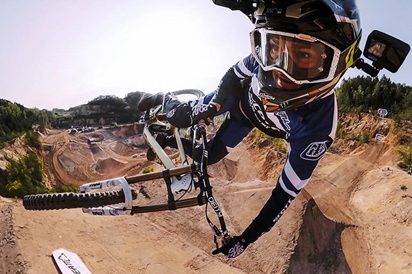 MTB rider getting air with a gopro on helmet